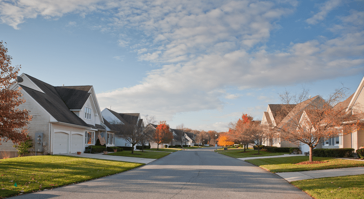 Street in Tallahassee neighborhood with homes for sale.